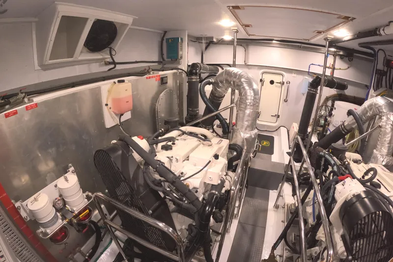Slide: The Image of Engine room of 2021 Kadey-Krogen 50 Open yacht, featuring dual engines and advanced equipment. - 45