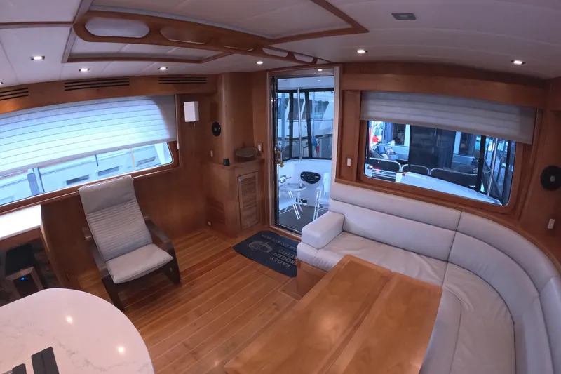 Slide: The Image of Luxurious interior of 2021 Kadey-Krogen 50 Open yacht with wood accents and comfortable seating. - 13