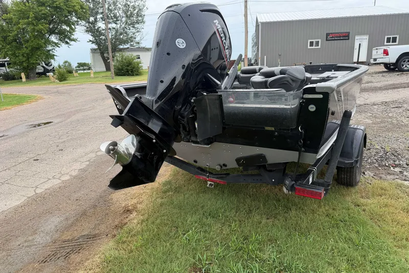 Slide: The Image of 2025 Lund 1875 Pro Guide boat with Mercury outboard motor on trailer. - 4