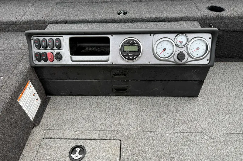 Slide: The Image of 2025 Lund 1875 Pro Guide boat dashboard with gauges and control panel. - 8