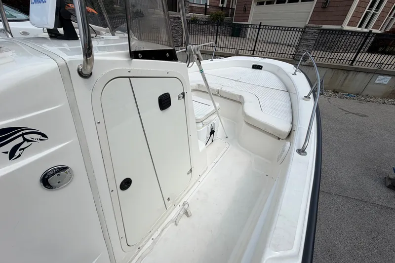 Slide: The Image of 2000 Boston Whaler 22 Dauntless boat interior with seating and storage compartments. - 15