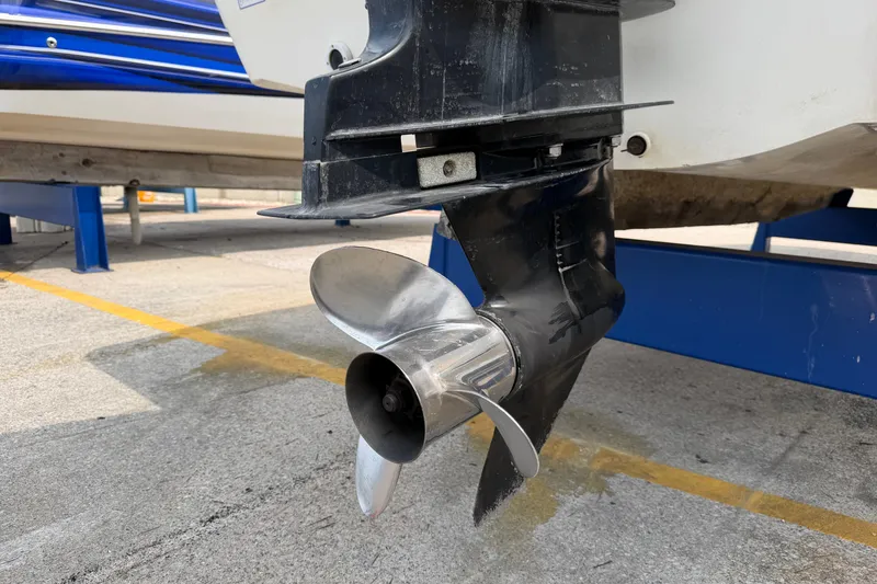 Slide: The Image of Propeller of a 2000 Boston Whaler 22 Dauntless boat on a trailer. - 22