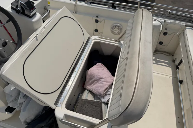 Slide: The Image of Open storage compartment on a 2000 Boston Whaler 22 Dauntless boat interior. - 17