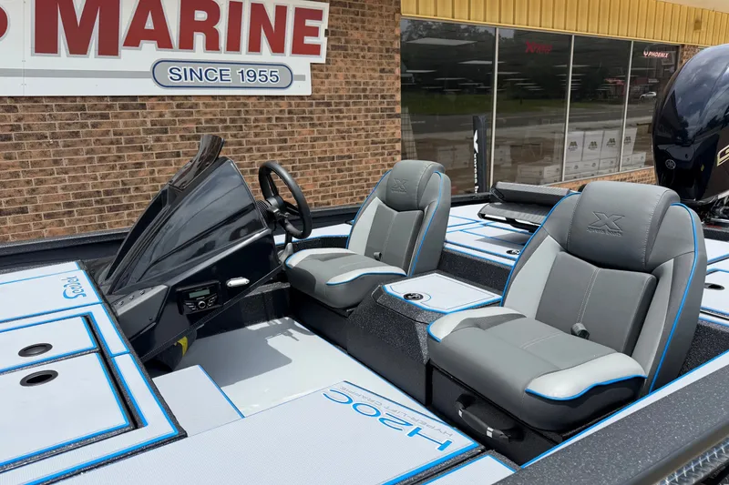 Slide: The Image of 2027 Xpress H20C Crappie boat interior with dual seats and steering console. - 3
