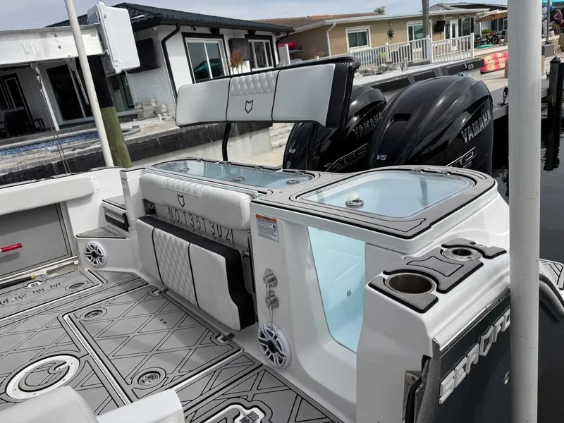 Slide: The Image of The image shows the stern of a 2025 Sea Fox 328 Commander with two Yamaha engines. - 12
