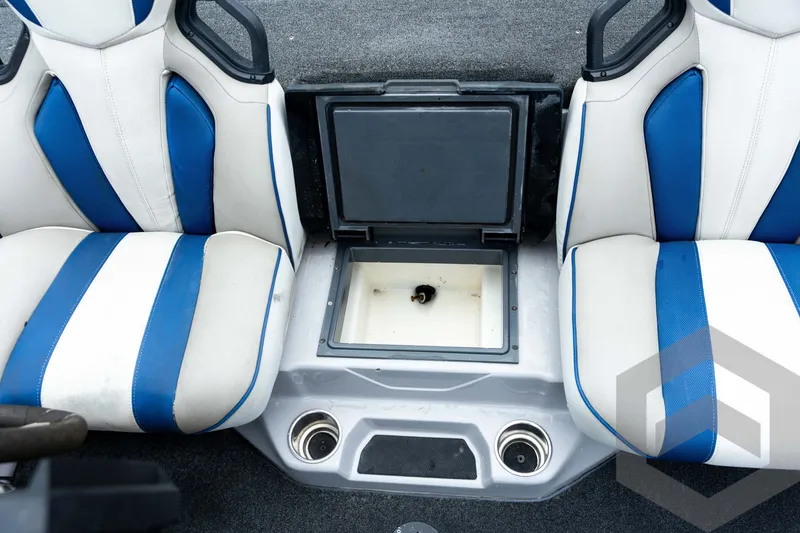 Slide: The Image of 2020 Skeeter FXR20 Limited boat interior with blue and white seats and storage compartment. - 24