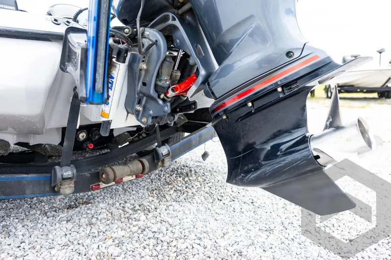 Slide: The Image of 2020 Skeeter FXR20 Limited boat motor and propeller on gravel surface. - 12