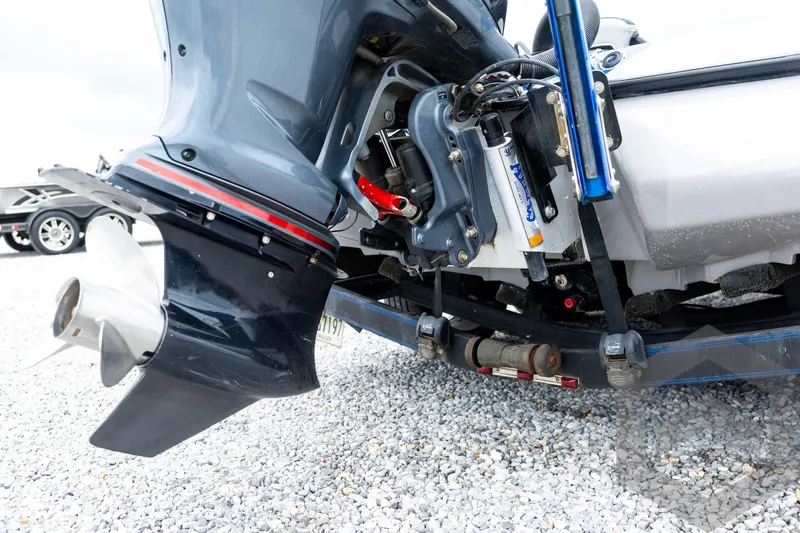 Slide: The Image of 2020 Skeeter FXR20 Limited boat motor and propeller on gravel surface. - 11
