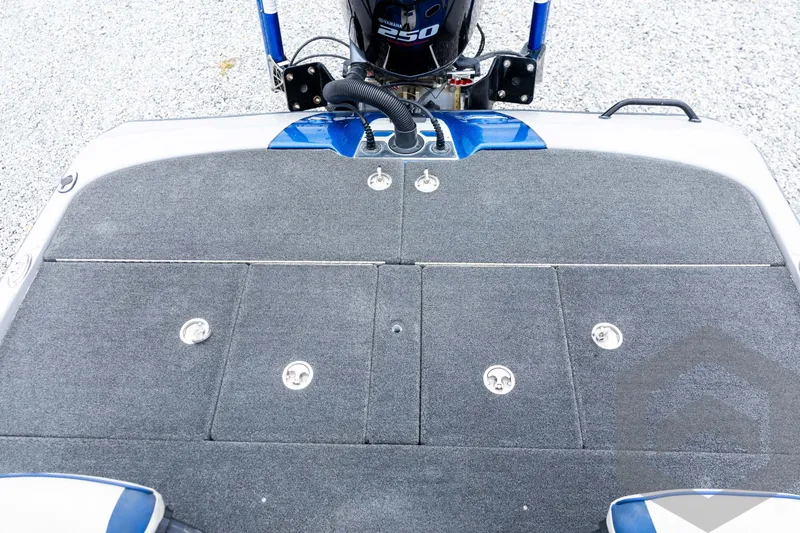 Slide: The Image of 2020 Skeeter FXR20 Limited boat deck with Yamaha 250 engine, featuring carpeted surface and storage compartments. - 25