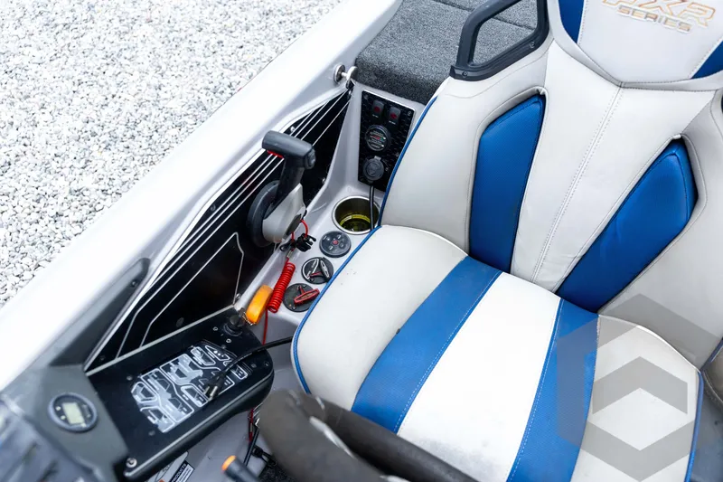 Slide: The Image of 2020 Skeeter FXR20 Limited boat cockpit with blue and white seat and control panel. - 22