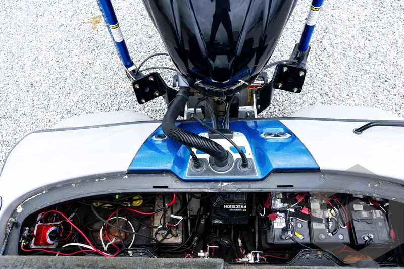 Slide: The Image of 2020 Skeeter FXR20 Limited boat engine compartment with wiring and batteries visible. - 27