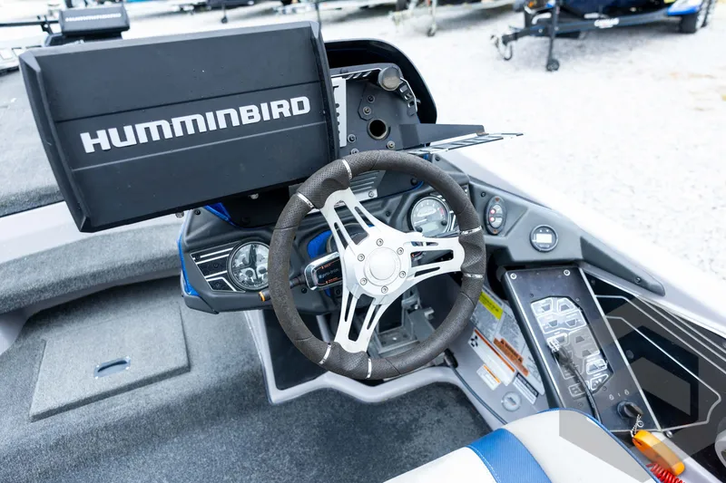 Slide: The Image of 2020 Skeeter FXR20 Limited boat dashboard with Humminbird electronics and steering wheel. - 21