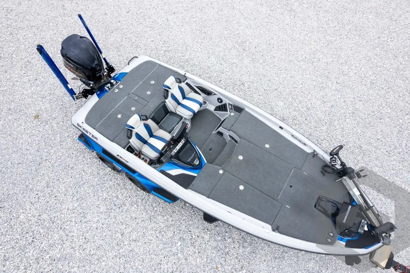 Slide: The Image of 2020 Skeeter FXR20 Limited bass boat, aerial view, gray and blue design. - 35