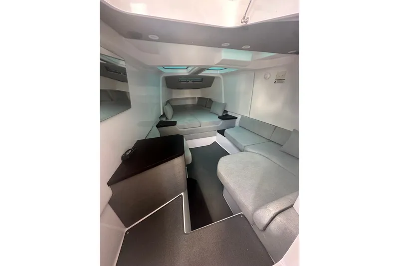 Slide: The Image of Luxurious interior of 2024 Axopar 37 Sun-Top boat with modern seating and sleek design. - 7