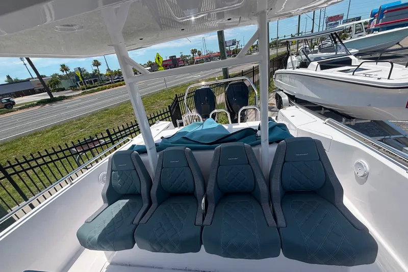 Slide: The Image of 2024 Axopar 37 Sun-Top boat interior with stylish seating and modern design. - 5