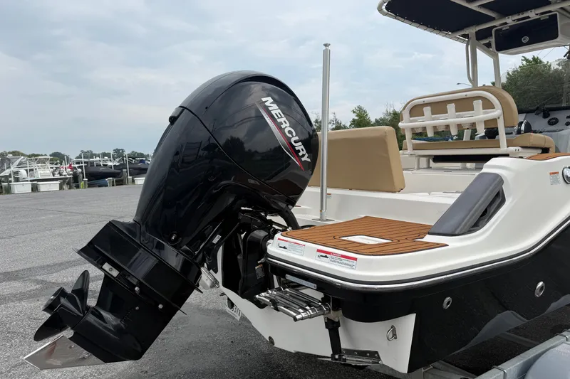 Slide: The Image of 2022 Bayliner Trophy T20CX boat with Mercury outboard motor, docked at marina. - 1