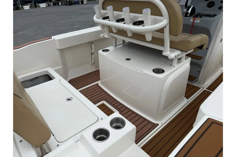 Slide: The Image of 2022 Bayliner Trophy T20CX boat interior with seating and cup holders. - 7