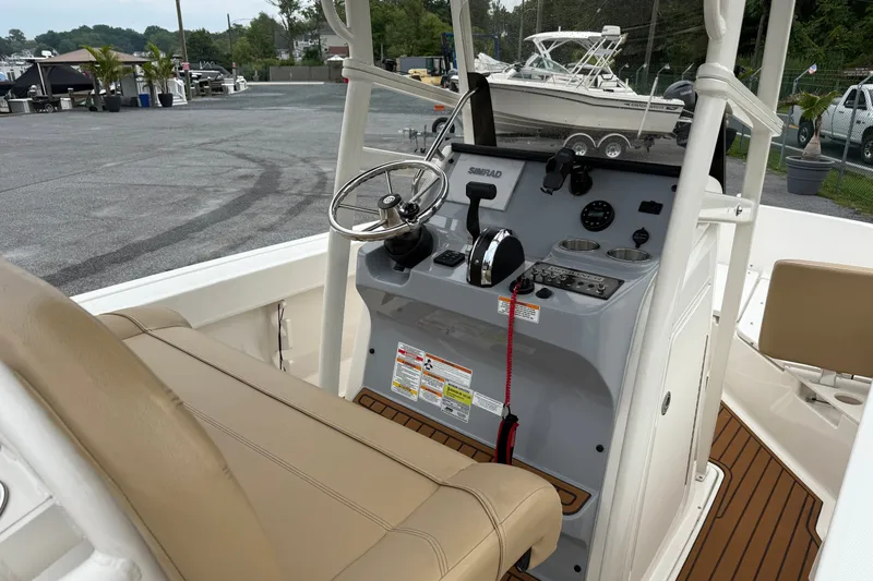 Slide: The Image of 2022 Bayliner Trophy T20CX boat console with steering wheel and controls. - 6