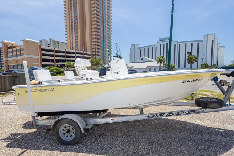 Slide: The Image of 2012 Sea Fox 180 Viper boat on trailer, parked near tall buildings. - 10