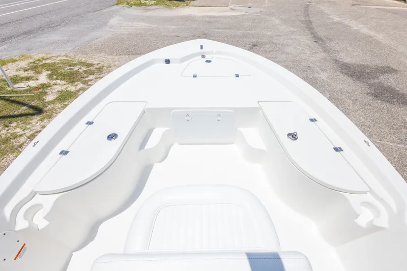 Slide: The Image of 2012 Sea Fox 180 Viper boat interior with storage compartments, parked on pavement. - 22