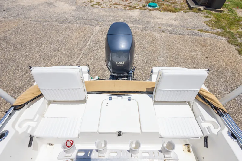 Slide: The Image of 2012 Sea Fox 180 Viper boat with Yamaha 90 engine, featuring white seating and deck. - 29
