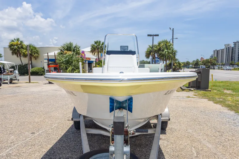 Slide: The Image of 2012 Sea Fox 180 Viper boat on trailer, parked outdoors under a clear sky. - 16