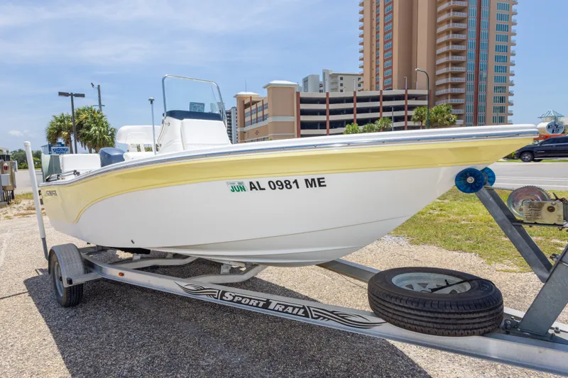 Slide: The Image of 2012 Sea Fox 180 Viper boat on trailer, parked near tall buildings. - 9