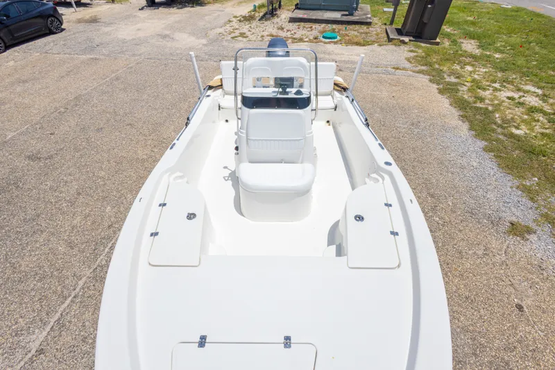 Slide: The Image of 2012 Sea Fox 180 Viper boat, white interior, parked on gravel, aerial view. - 23