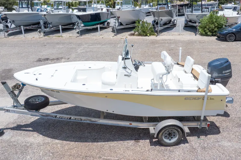 Slide: The Image of 2012 Sea Fox 180 Viper boat on trailer, parked in a marina. - 3
