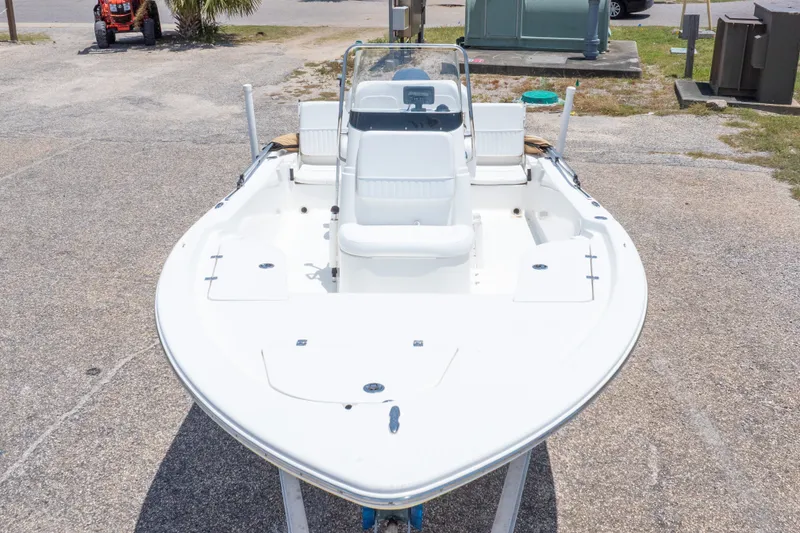Slide: The Image of 2012 Sea Fox 180 Viper boat on display in a parking area. - 5