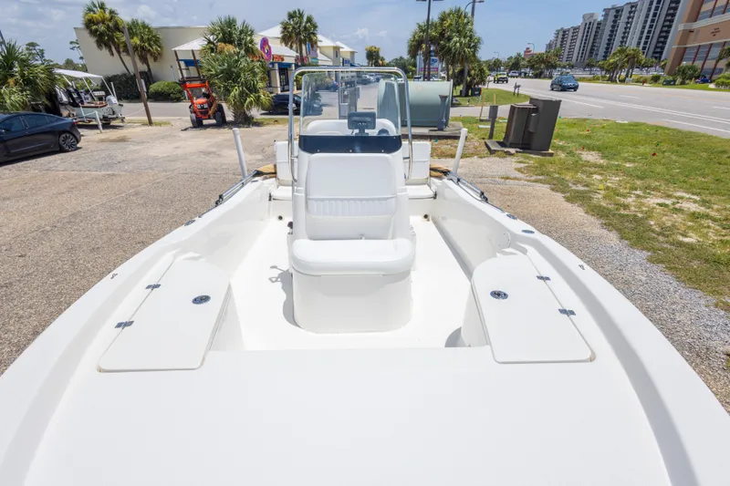 Slide: The Image of 2012 Sea Fox 180 Viper boat parked near a road with palm trees. - 24