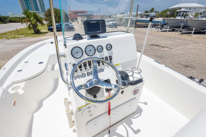 Slide: The Image of 2012 Sea Fox 180 Viper boat dashboard with steering wheel and navigation instruments. - 32