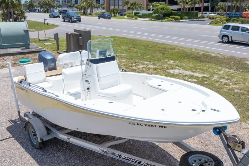 Slide: The Image of 2012 Sea Fox 180 Viper boat on trailer, parked near a road. - 1