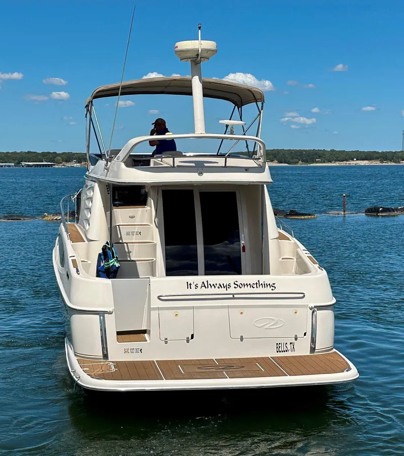 Slide: The Image of 2001 Regal Commodore 3780 yacht on water, sunny day, rear view. - 10