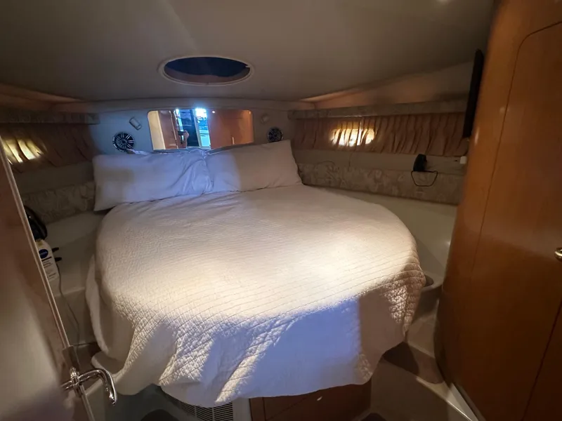 Slide: The Image of Cozy bedroom in 2001 Regal Commodore 3780 yacht with round bed and soft lighting. - 39