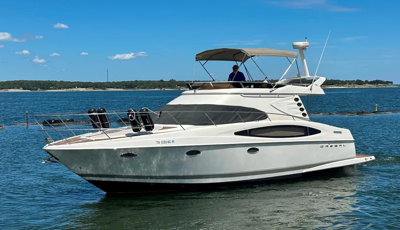 The Image of 2001 Regal Commodore 3780 yacht cruising on a sunny day. - 0