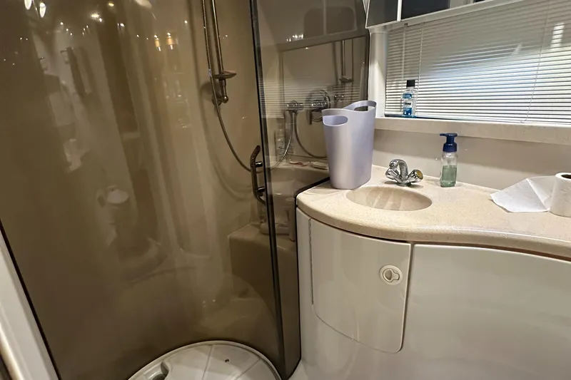 Slide: The Image of Bathroom interior of 2001 Regal Commodore 3780 yacht with shower and sink. - 49