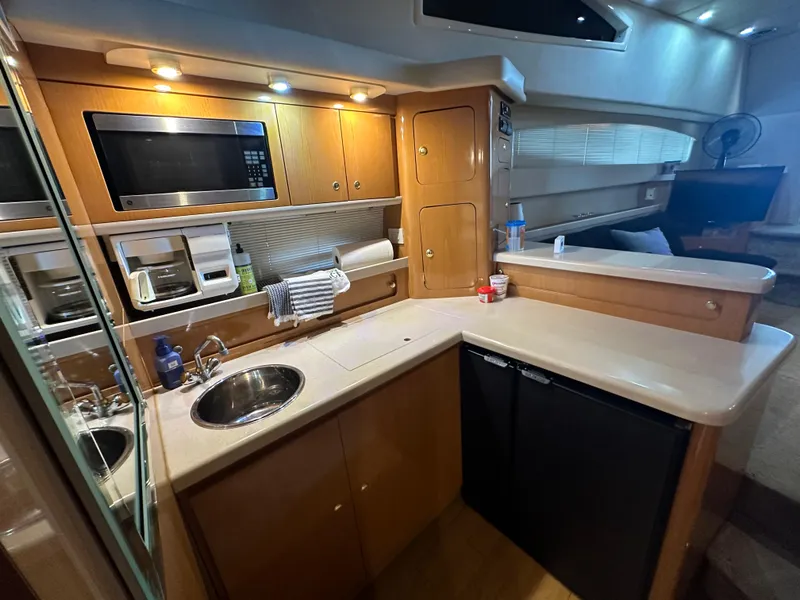 Slide: The Image of Luxurious kitchen in 2001 Regal Commodore 3780 yacht with modern amenities. - 44