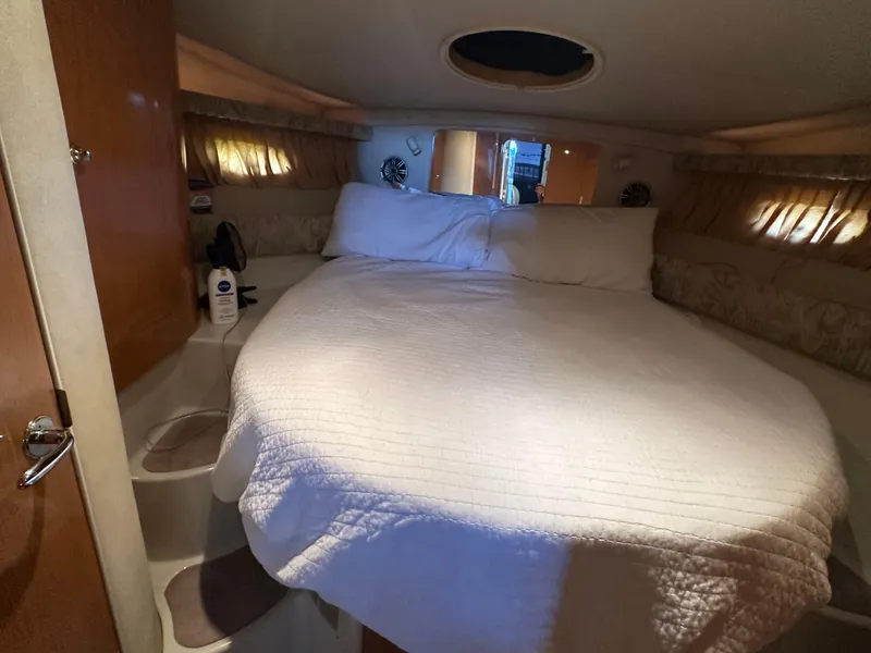 Slide: The Image of Cozy cabin interior of 2001 Regal Commodore 3780 yacht with a comfortable bed. - 40