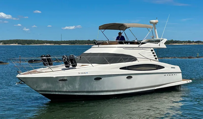 Slide: The Image of 2001 Regal Commodore 3780 yacht cruising on a sunny day. - 1