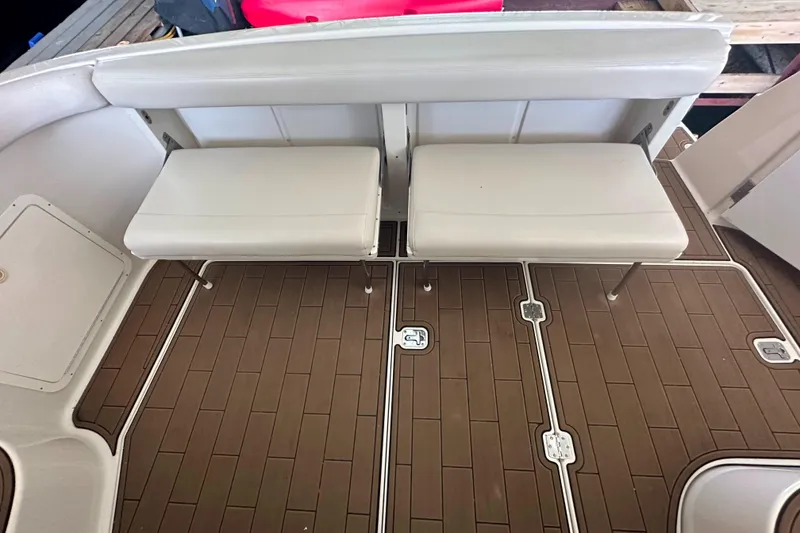 Slide: The Image of 2001 Regal Commodore 3780 boat interior with beige seating and brown flooring. - 29
