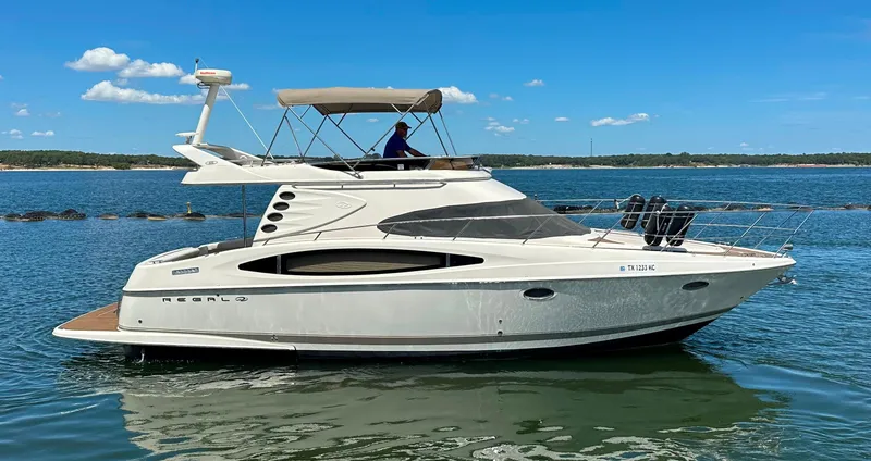 Slide: The Image of 2001 Regal Commodore 3780 yacht cruising on a sunny day. - 7