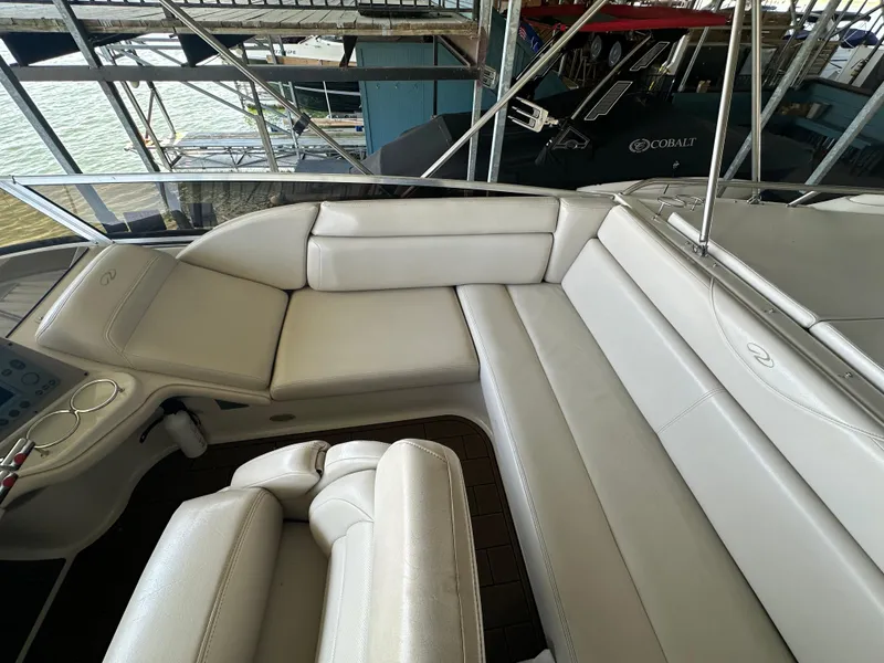 Slide: The Image of 2001 Regal Commodore 3780 boat interior with white leather seating. - 18