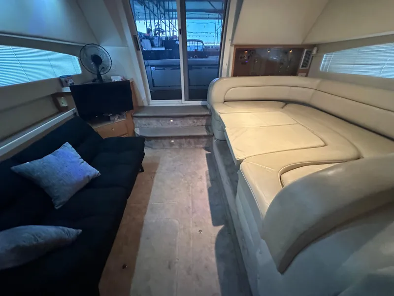 Slide: The Image of Interior of 2001 Regal Commodore 3780 yacht with plush seating and modern amenities. - 31