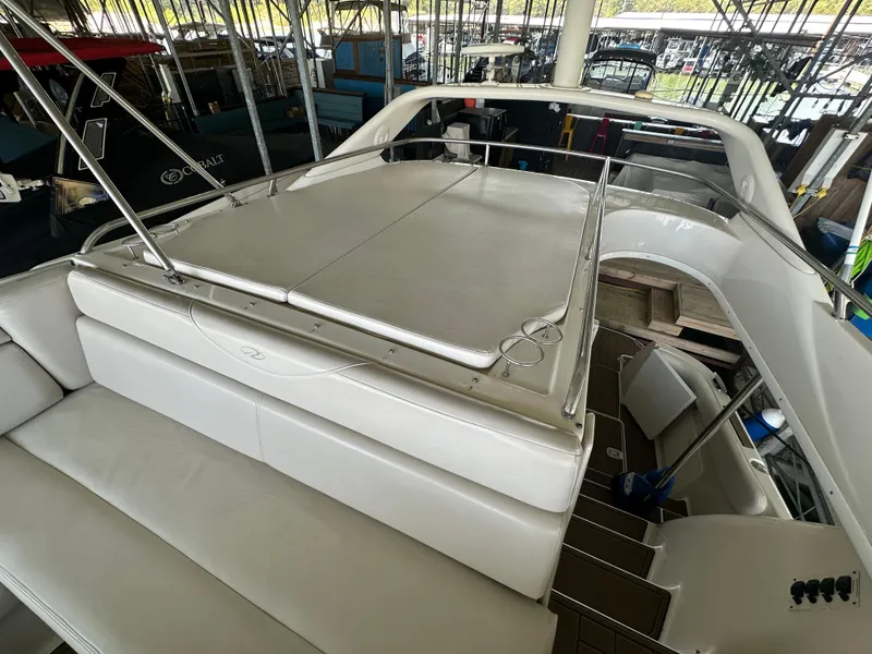 Slide: The Image of 2001 Regal Commodore 3780 yacht interior with white seating and sun deck. - 19