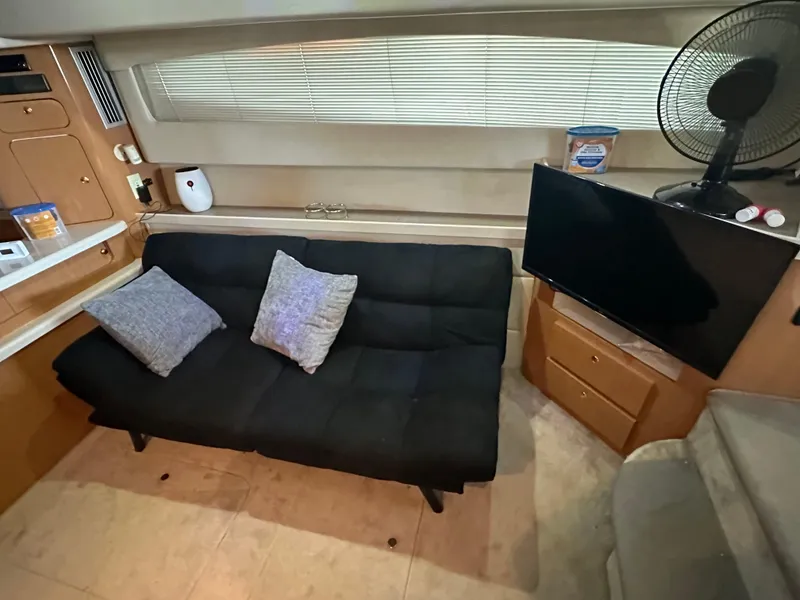 Slide: The Image of Interior of 2001 Regal Commodore 3780 yacht with sofa, TV, and fan. - 35