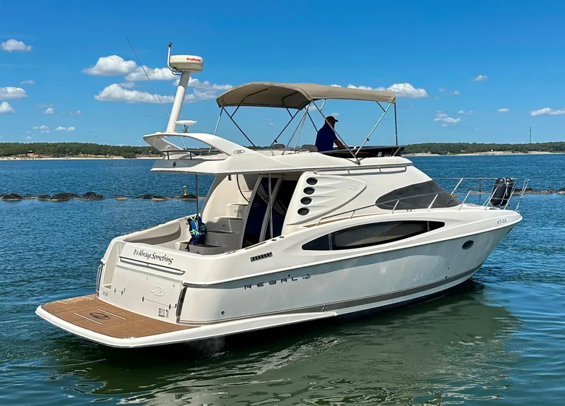 Slide: The Image of 2001 Regal Commodore 3780 yacht cruising on a sunny day. - 8