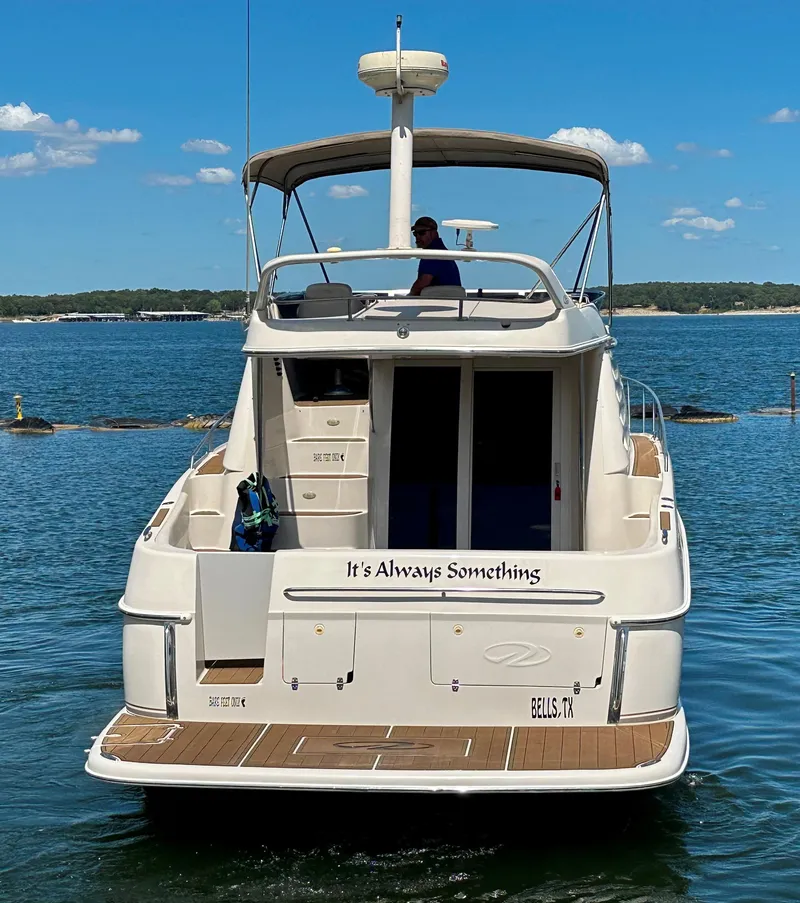 Slide: The Image of 2001 Regal Commodore 3780 yacht on water, rear view, sunny day. - 9