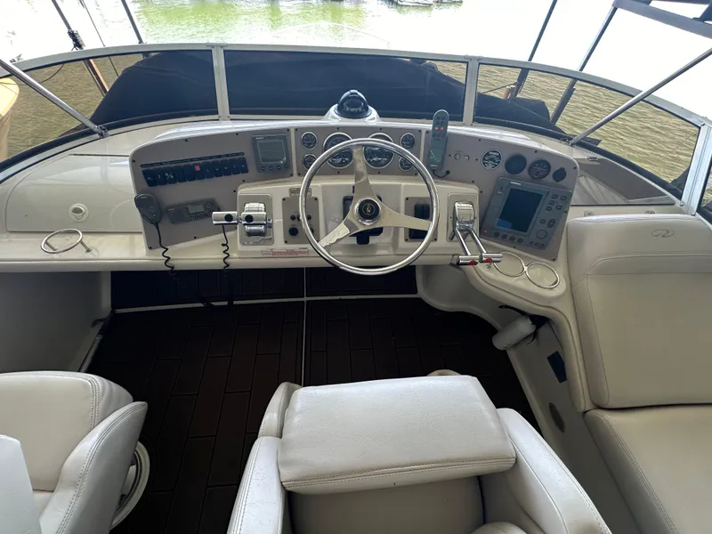 Slide: The Image of 2001 Regal Commodore 3780 helm with steering wheel and navigation controls. - 22