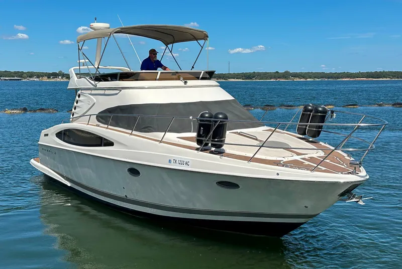 Slide: The Image of 2001 Regal Commodore 3780 yacht cruising on a sunny day. - 5